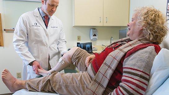 Dr. Sean Burns with a orthopaedic patient